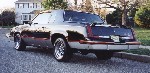 Rear shot of a black 1986 Hurst/Olds