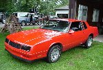 Hot red Chevy Monte Carlo SS.  Nice blackout package!